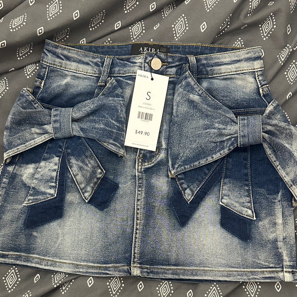 AKIRA Distressed Blue Denim Mini Skirt with Bow Details